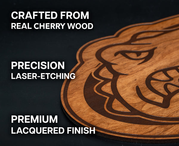 a wooden object with a carved design, including a face and a mouth, and it is described as a "crafted from real cherry wood" and "precision laser-etching".