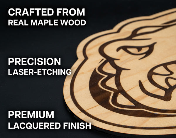 a close-up of a wooden object, possibly a piece of furniture or a decorative item, with a detailed engraved design on it.